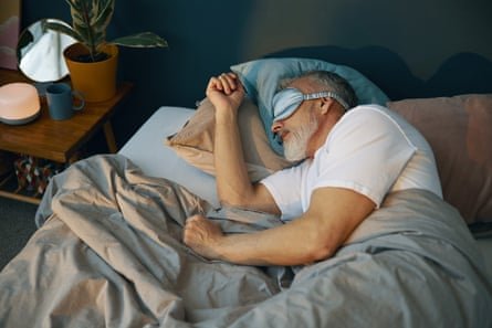 A Photo of a man in a sleep mask