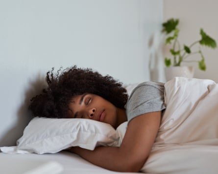 Young woman asleep in her bed.