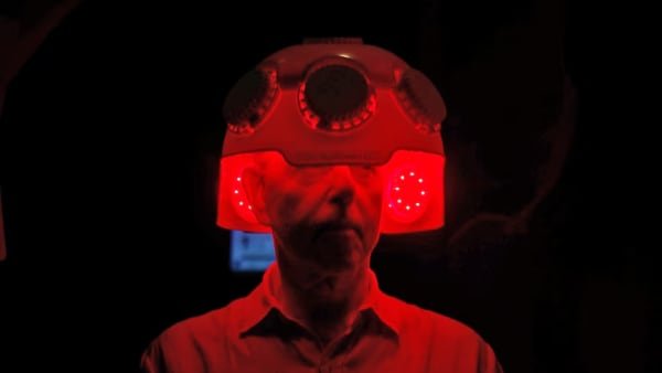 Norman Swan samples red light therapy at a biohacking conference. (