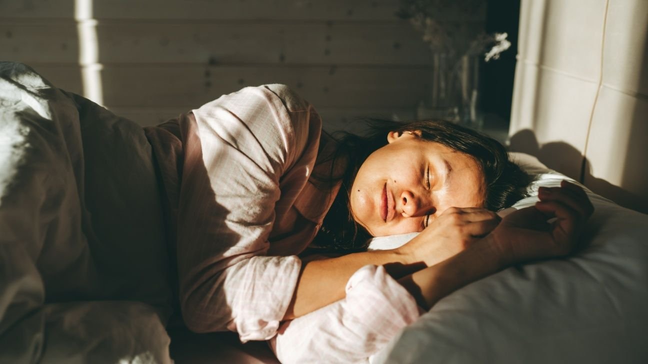 A person is lying in bed.