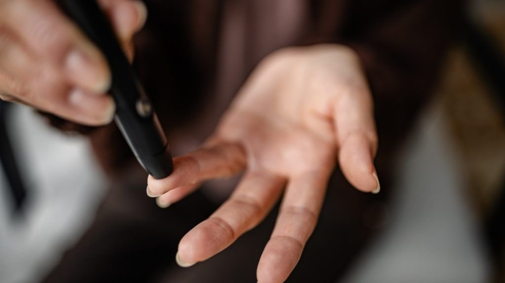 A person checking their blood sugar levels.
