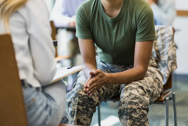 military serviceperson talking with a counselor