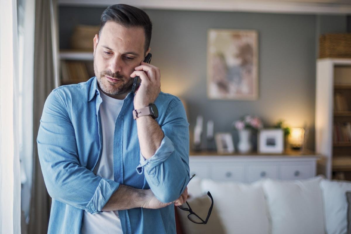 Man listens on a phone
