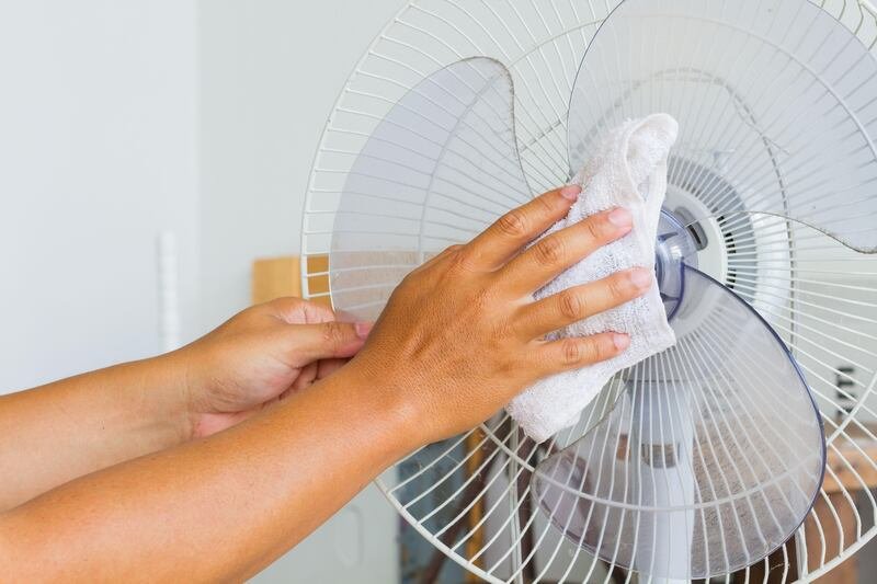 This is a generic photo of a hand cleaning a dusty fan with a cloth. See PA Feature WELLBEING Sleep. WARNING: This picture must only be used to accompany PA Feature WELLBEING Sleep. PA Photo. Photo credit should read: Alamy/PANOTE TO EDITORS: This picture must only be used to accompany PA Feature WELLBEING Sleep