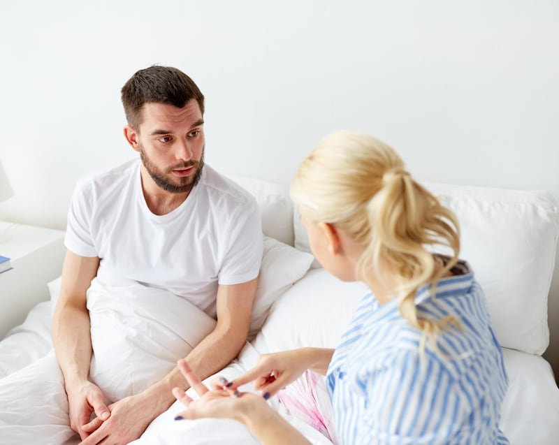 This is a generic photo of a man and woman having a serious conversation in bed. See PA Feature WELLBEING Sleep. WARNING: This picture must only be used to accompany PA Feature WELLBEING Sleep. PA Photo. Photo credit should read: Alamy/PANOTE TO EDITORS: This picture must only be used to accompany PA Feature WELLBEING Sleep