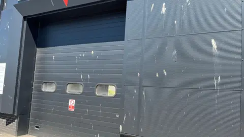 The black-painted Peugeot garage on the Hopkins Industrial Estate in Devizes covered in birds' mess.