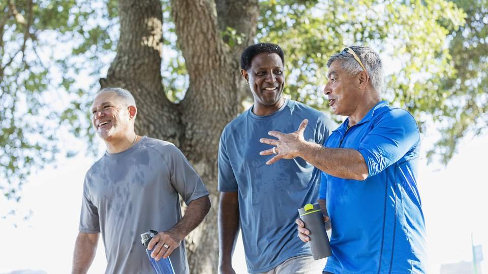 A group of men exercising outside