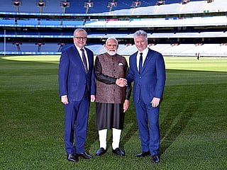 Australia’s Prime Minister Anthony Albanese (L) stands next to Indian Prime Minister Narendra Modi (C) as he shakes hands with former Australian cricket team captain Steve Waugh (R) during a visit to the Melbourne Cricket Ground (MCG) on July 10, 2026.