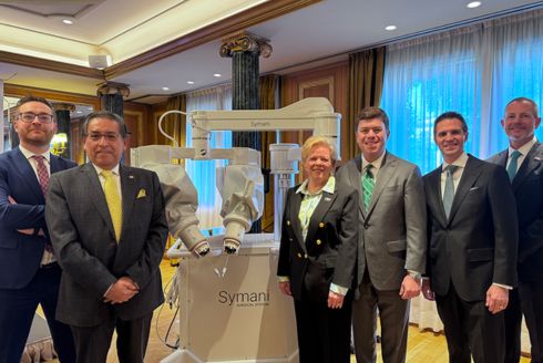 Representatives from the University of South Florida, Tampa General Hospital and Medical Microinstruments pose with the Symani Surgical System