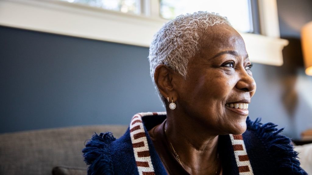 close-up portrait of older Black woman smiling