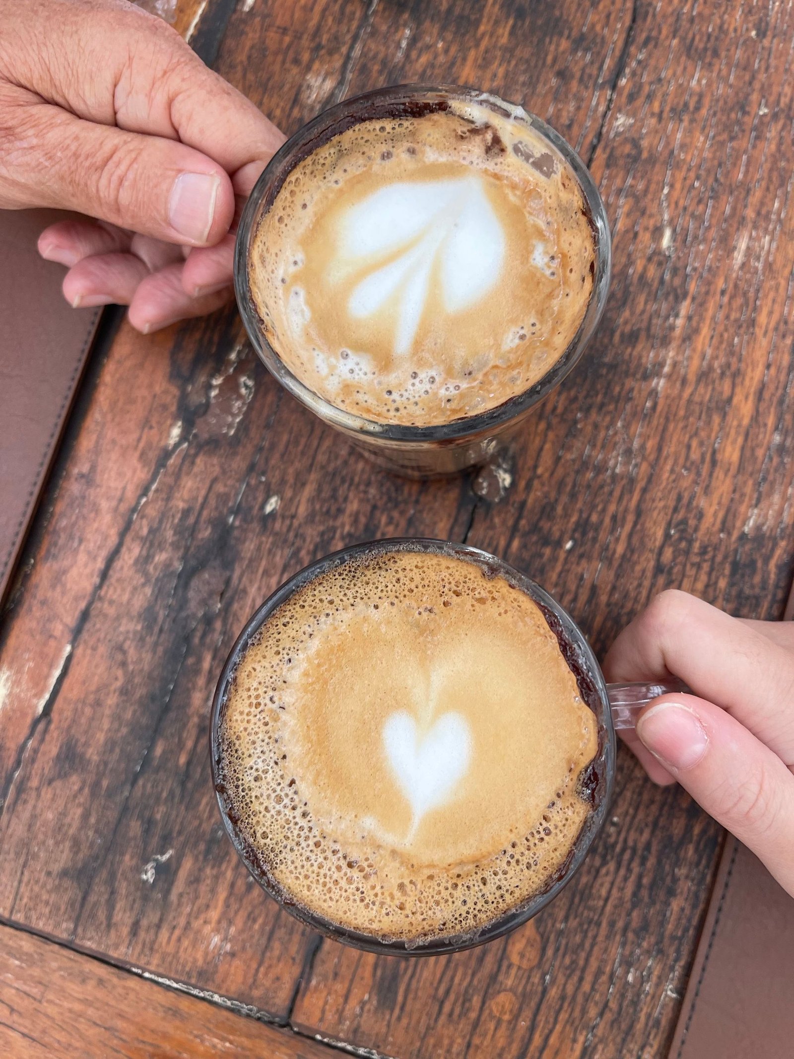People holding coffee mugs