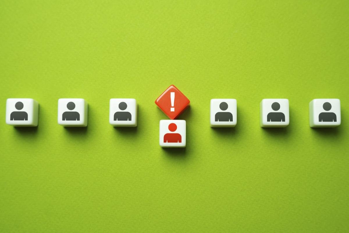 Row of figures with one called out by an exclamation point