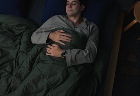 Sleeping man wearing Huawei Watch D3
