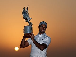 The two gloved player returns to defend his title